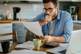 man going over his bills
