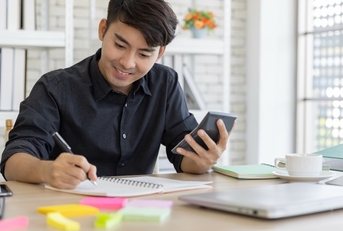 young man using the calculator