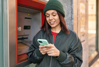 A woman using an ATM
