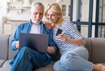 A couple researching best balance transfer cards