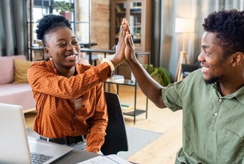 african american colleagues doing high five