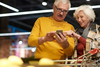 senior couple grocery shopping