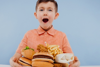 excited little boy with foods