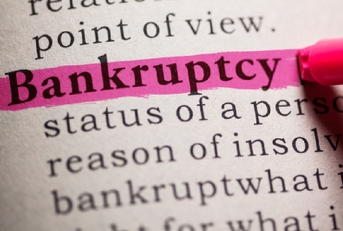 Bankruptcy highlighted on paper