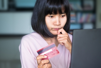 girl holding credit card