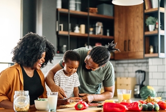 happy african american family cooking together