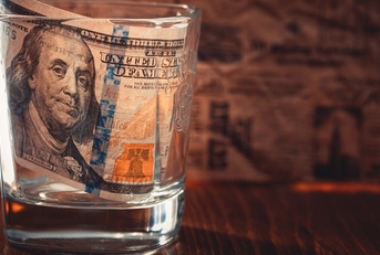 100 dollar bill in glass