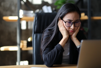 unhappy asian entrepreneur 