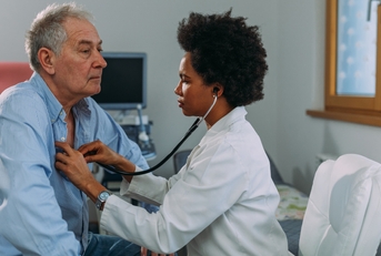 female doctor examining a patient