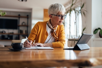 senior businesswoman writing