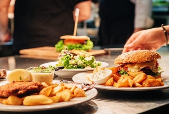 Food orders on the kitchen table in the restaurant.