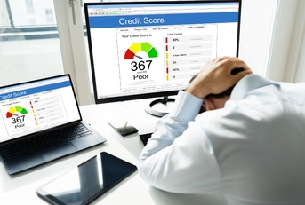 man frustrated at Poor Credit Score