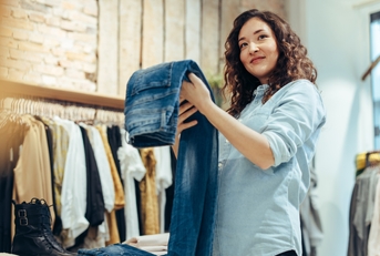 woman shopping in clothing store