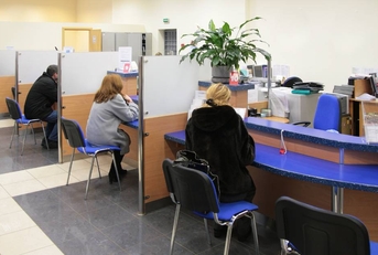 busy bank with people sitting with loan consultants