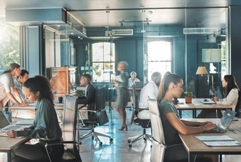  business people working in busy marketing office space