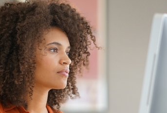 Woman looking at a computer