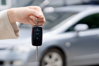 giving car key to new owner