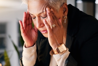 senior business woman having headache