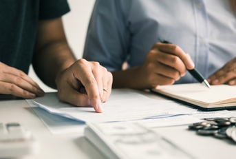 couples analyzing expenses together