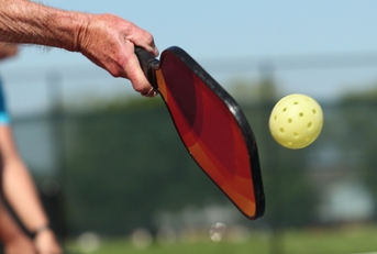 pickleball is played outdoors