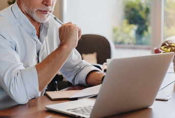 senior man using laptop 