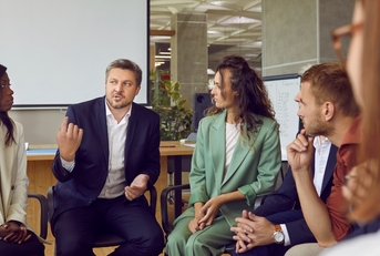 business team meeting with professional coach