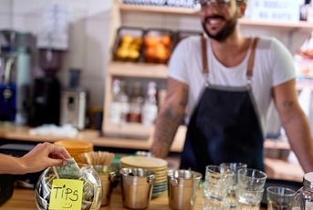 tips jar at table in cafe