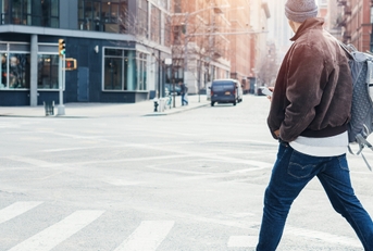 man crossing the road