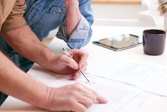 mature couple reviewing domestic finances