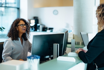 administrator assisting a woman