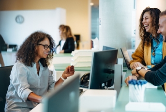 receptionist assisting people 