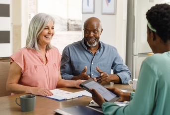 couple talking to financial advisor