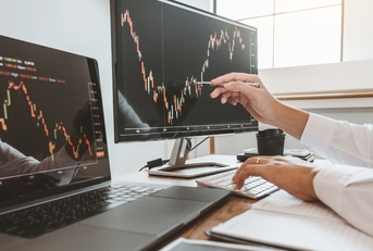 businessman analysing stock market graphs
