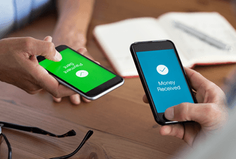 Two people hold phones and send money with a mobile payment app. 