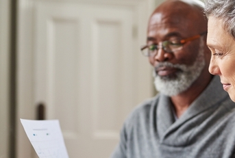 senior couple reviewing budget together