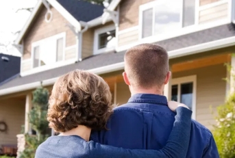Couple outside of house