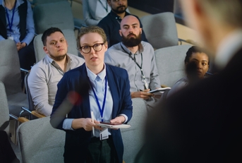 female journalist asking politician questions