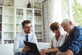 senior couple planning investments with financial advisor