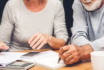 senior couple reading documents