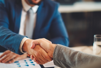 businessman shaking hand with client