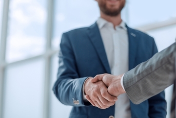 business partners shaking hands partnership concept