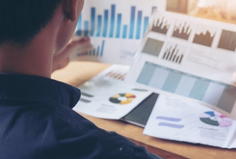 businessman reviews paper