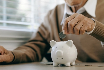 old man putting money coins 