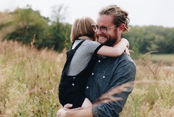 Dad having fun with daughter