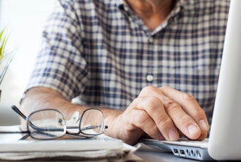Senior man working on computer