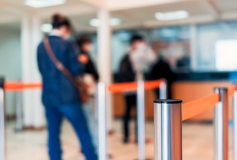 row of people to the bank teller