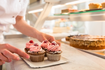 putting muffins on display 