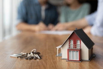 Key and tiny toy house