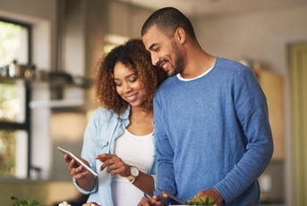 couple using a digital tablet