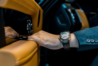 businessman coming out of luxury car